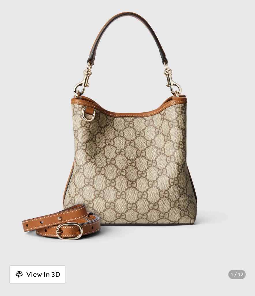 Monogram bucket bag with tan leather trim